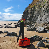 Orange_turtleback_bag_on_the_beach