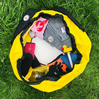 Yellow Turtleback outdoor swim bag from above with swim kit inside